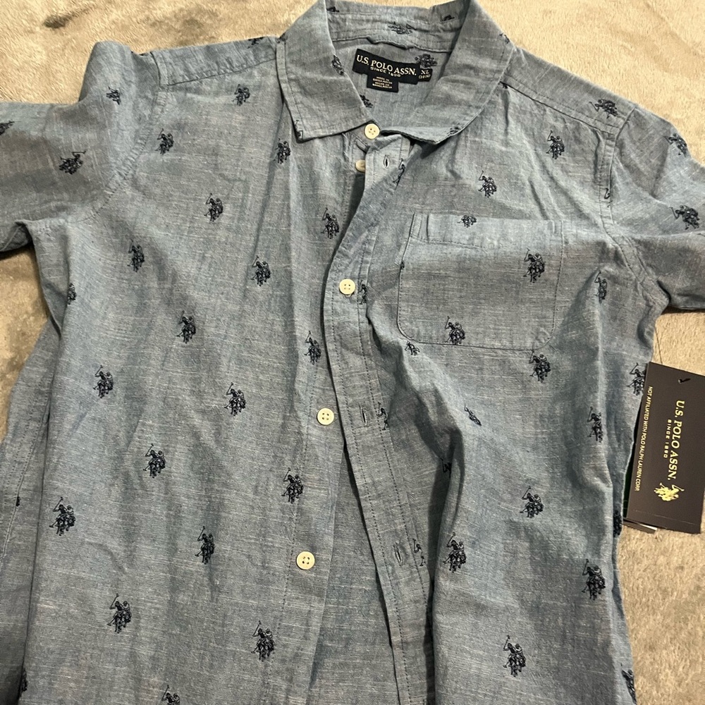 Brand New with tags Boys U.S. Polo Assn. button down t-shirt. Size XL (14-16)